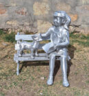 Girl on Bench with Dog